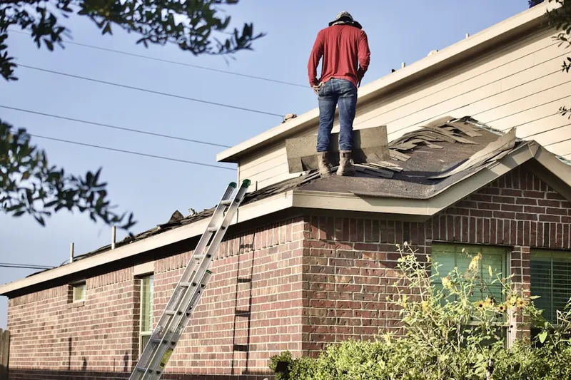 Professional roofer working on a residential roof in Doris